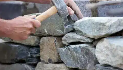 What is the best way to consolidate a stone wall?